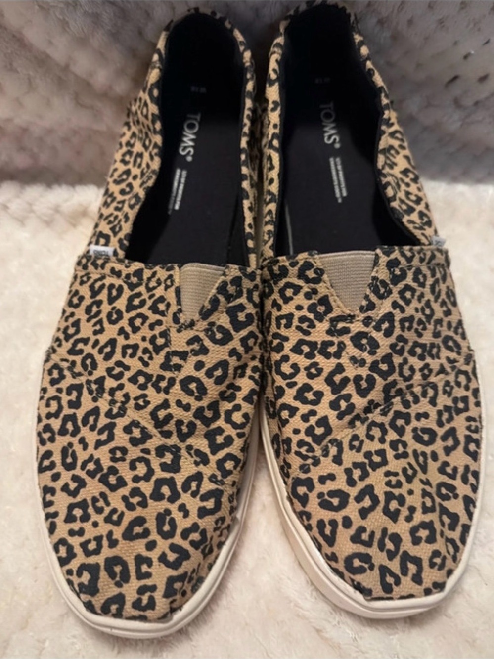 Toms women’s Leopard Print Slip-On Loafers in Tan and Black
